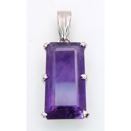 614 - An Amethyst Rectangular Step Cut Pendant set in 925 Sterling silver. 7g weight. 20ct Amethyst. 4cm. ... 