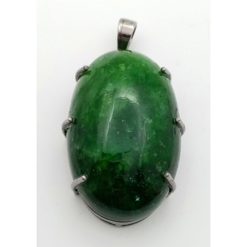 628 - A Large Emerald Cabochon Pendant set in 925 Sterling Silver. 153.20ct. W- 36.50g. Comes in a present... 