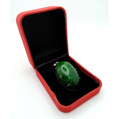 628 - A Large Emerald Cabochon Pendant set in 925 Sterling Silver. 153.20ct. W- 36.50g. Comes in a present... 