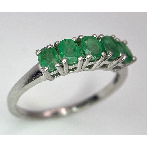 895 - A Vintage 5 Stone Sterling Silver Emerald Ring Size Q. The ring is set with five 4mm Oval Cut Emeral... 