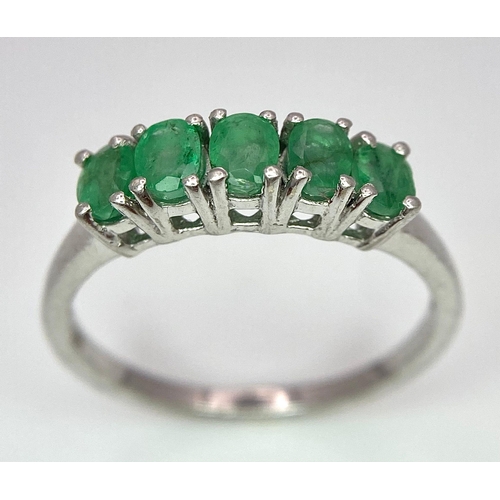 895 - A Vintage 5 Stone Sterling Silver Emerald Ring Size Q. The ring is set with five 4mm Oval Cut Emeral... 