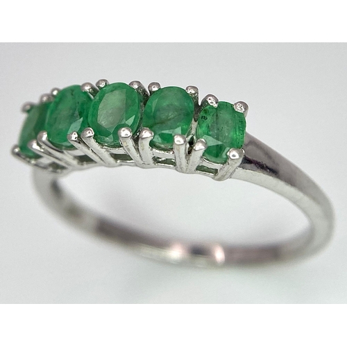 895 - A Vintage 5 Stone Sterling Silver Emerald Ring Size Q. The ring is set with five 4mm Oval Cut Emeral... 