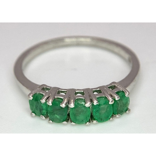 895 - A Vintage 5 Stone Sterling Silver Emerald Ring Size Q. The ring is set with five 4mm Oval Cut Emeral... 