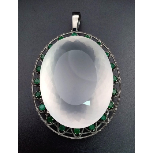 635 - A Large Rose Quartz Silver Pendant with Emeralds set in 925 Sterling silver. Oval cut Rose Quartz. 2... 