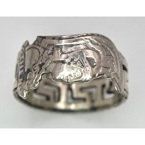 958 - An interesting sterling silver ring, designed by Adam Athena, converted from an old spoon handle. Si... 