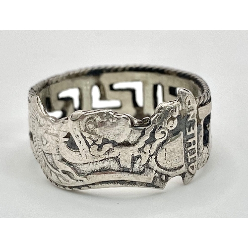 958 - An interesting sterling silver ring, designed by Adam Athena, converted from an old spoon handle. Si... 