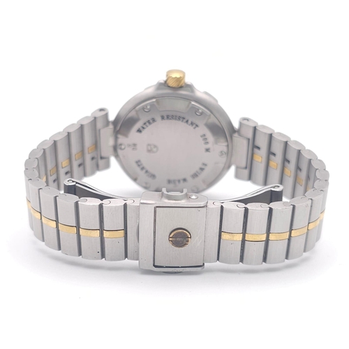 656 - A Dunhill Quartz Ladies Watch. Two tone stainless steel bracelet and case - 29mm. White dial with da... 