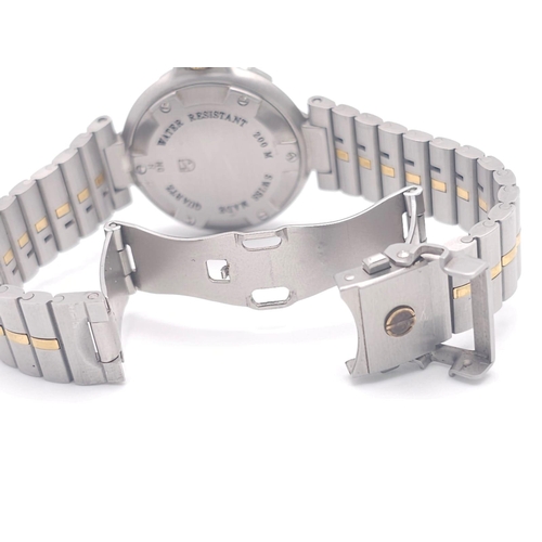 656 - A Dunhill Quartz Ladies Watch. Two tone stainless steel bracelet and case - 29mm. White dial with da... 