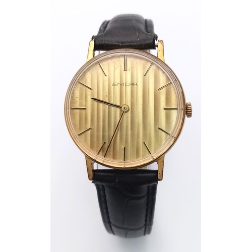 759 - A Vintage Enicar Mechanical Gents Watch. Black leather strap. Gilded stainless steel case - 33mm. Go... 