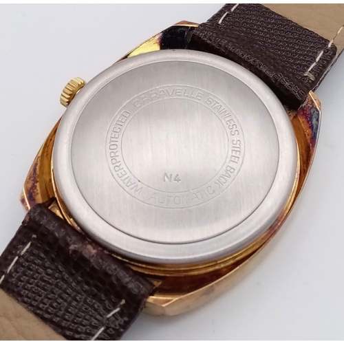 773 - A Vintage Automatic Caravelle Gents Watch. Brown leather strap. Gilded stainless steel case - 38mm. ... 