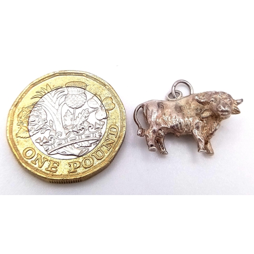 755 - A sterling silver charm in the shape of a bull. Weight: 5.5 g.