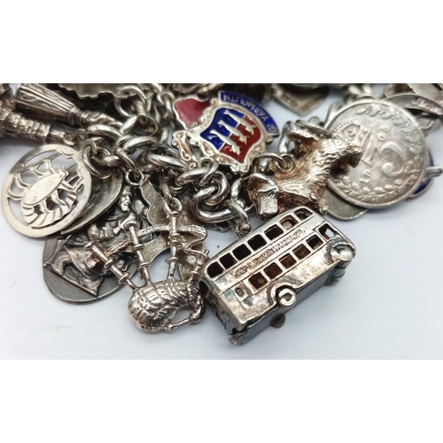 955 - A vintage sterling silver multiple charms chunky bracelet include famous landmarks, etc. Total weigh... 