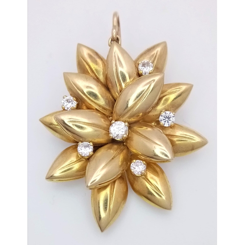 571 - A 9K Yellow Gold (tested) and Diamond Decorative Floral Brooch. Six brilliant white zircons amongst ... 