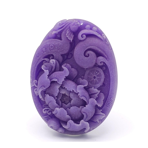 641 - A Beautiful Dark Lavender Jade Oval Pendant. Decorative floral decoration. 6cm.