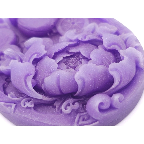 641 - A Beautiful Dark Lavender Jade Oval Pendant. Decorative floral decoration. 6cm.