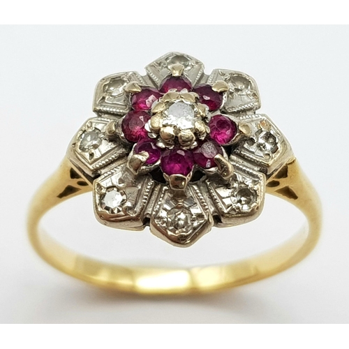 820 - AN 18K GOLD RING WITH DIAMONDS AND RUBY SET IN PLATINUM IN FLORAL FORM  . A VERY PRETTY RING .     4... 