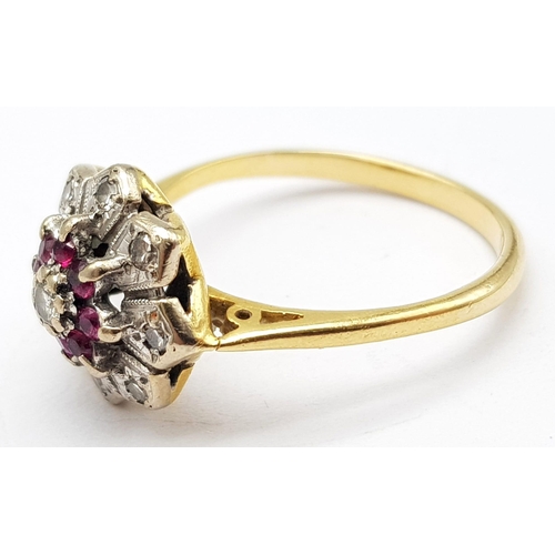 820 - AN 18K GOLD RING WITH DIAMONDS AND RUBY SET IN PLATINUM IN FLORAL FORM  . A VERY PRETTY RING .     4... 