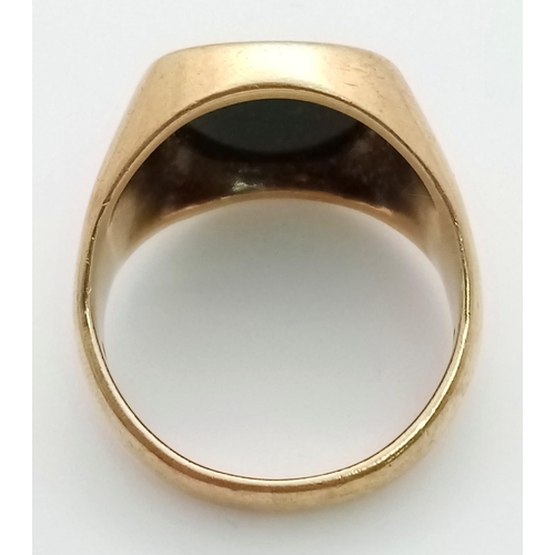 659 - A GENTS 9K GOLD SIGNET RING WITH BLACK OPAL STONE (SMALL CHIP IN STONE) ..10.5gms    size