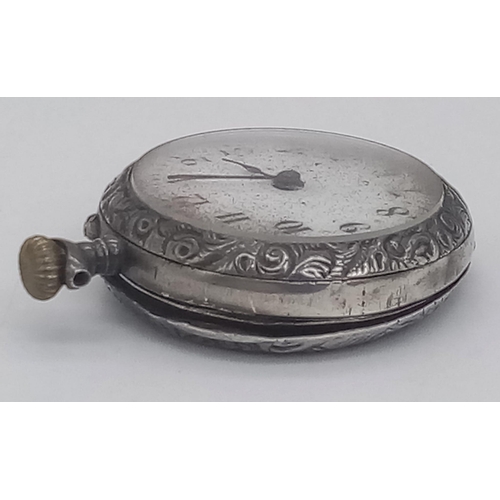 675 - A SILVER MINITURE POCKET WATCH FOR SPARES OR REPAIR.