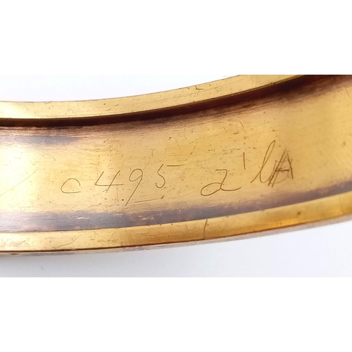 713 - A 9K GOLD BACK AND FRONT HINGED BANGLE .   13.4gms