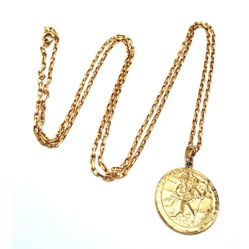 743 - A 74cms 9K GOLD CHAIN WITH A MODERN ST. CHRISTOPHER PENDANT .  10.8gms