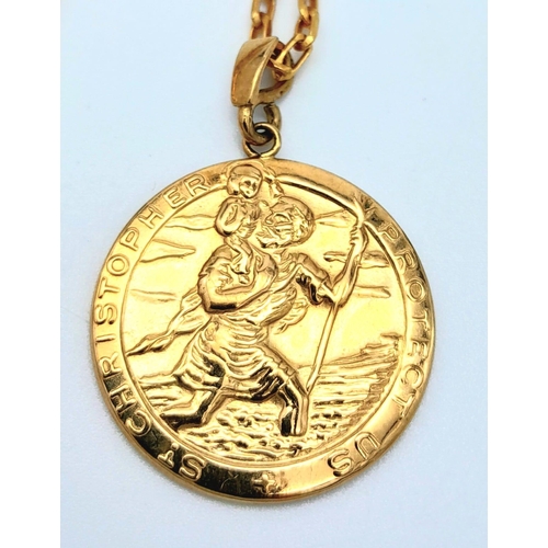 743 - A 74cms 9K GOLD CHAIN WITH A MODERN ST. CHRISTOPHER PENDANT .  10.8gms