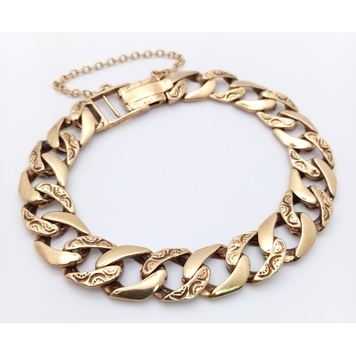 758 - A CHUNKY 9K GOLD BRACELET WITH BARKED FINISH AND SAFETY CHAIN .29.8gms    20cms