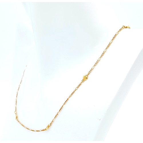 776 - A 9K GOLD 42cms NECKLACE WITH SMALL HEART SPACERS .   2.7gms