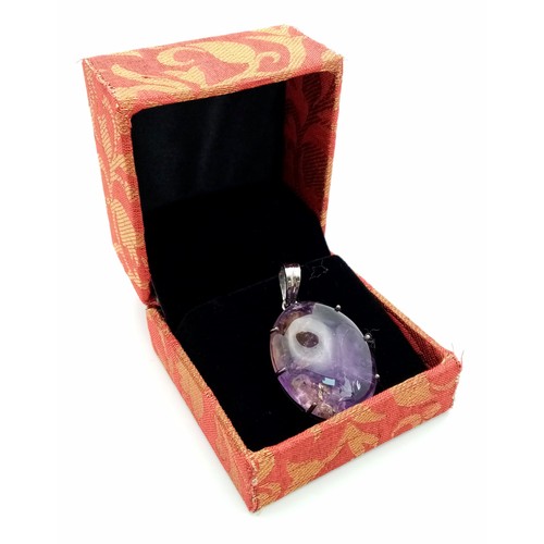 577 - A 50ct Oval Amethyst Pendant set in 925 Sterling silver.  W-13.70g. 5cm. Comes with a presentation c... 