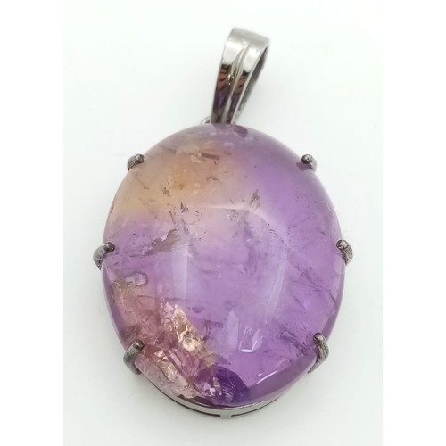 577 - A 50ct Oval Amethyst Pendant set in 925 Sterling silver.  W-13.70g. 5cm. Comes with a presentation c... 