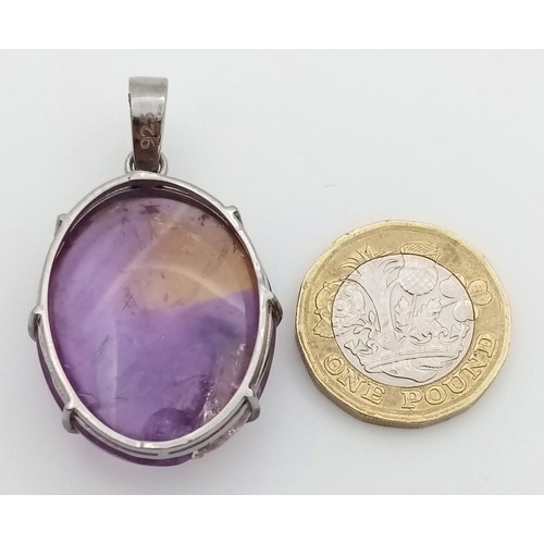 577 - A 50ct Oval Amethyst Pendant set in 925 Sterling silver.  W-13.70g. 5cm. Comes with a presentation c... 