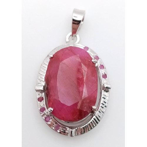 621 - A Ruby Oval Cut Pendant set in 925 Sterling silver. W- 20g. 70ct. 5cm. Comes with a presentation cas... 