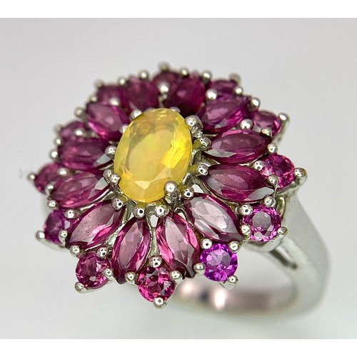 909 - A Very Impressive Opal and Rhodolite Garnet Sterling Silver Ring Size R. The Crown Measures 2.9cm Di... 