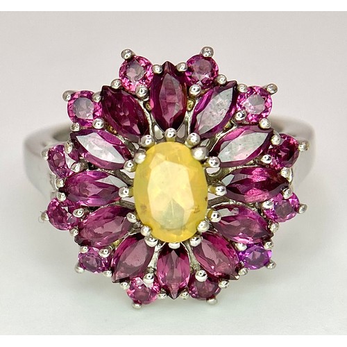 909 - A Very Impressive Opal and Rhodolite Garnet Sterling Silver Ring Size R. The Crown Measures 2.9cm Di... 