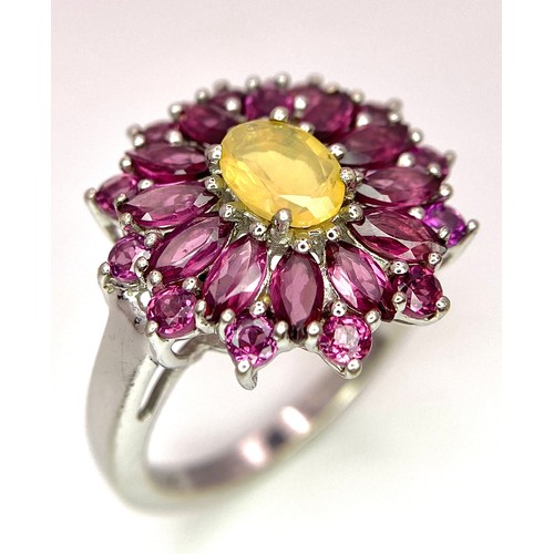 909 - A Very Impressive Opal and Rhodolite Garnet Sterling Silver Ring Size R. The Crown Measures 2.9cm Di... 