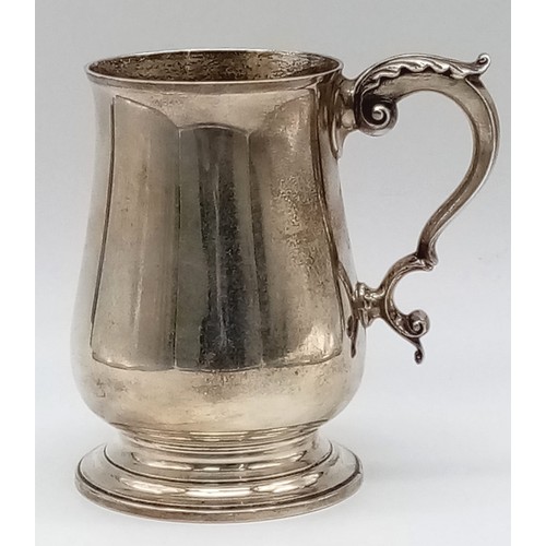 771 - A Vintage Sterling Silver Tankard. Classic design with an ornate handle. 14cm tall. Hallmarks for Lo... 