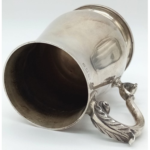 771 - A Vintage Sterling Silver Tankard. Classic design with an ornate handle. 14cm tall. Hallmarks for Lo... 