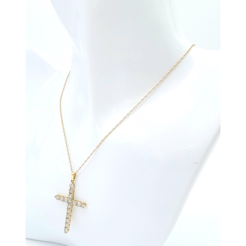 640 - A DIAMOND CROSS PENDANT WITH 15 QUALITY DIAMOND STONES  ON A 46cms 9K GOLD NECK CHAIN .    3.1gms   ... 