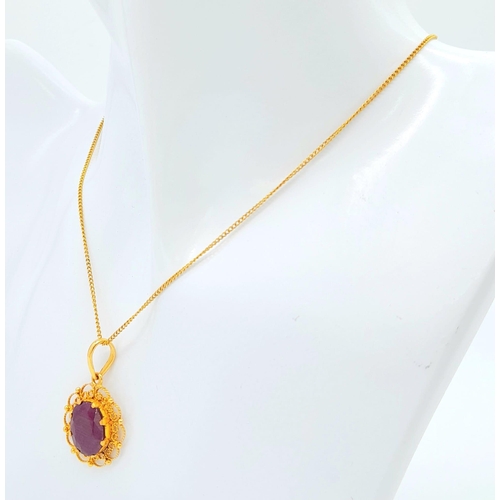 654 - A VERY PRETTY 18K GOLD PENDANT WITH LARGE RUBY ON A 42cms GOLD CHAIN .5.3gms    16522