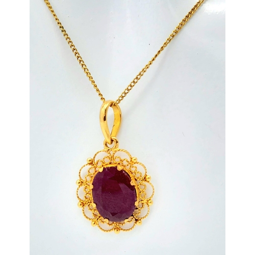 654 - A VERY PRETTY 18K GOLD PENDANT WITH LARGE RUBY ON A 42cms GOLD CHAIN .5.3gms    16522