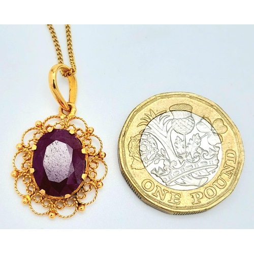 654 - A VERY PRETTY 18K GOLD PENDANT WITH LARGE RUBY ON A 42cms GOLD CHAIN .5.3gms    16522