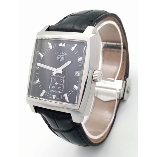 660 - A Tag Heuer Monaco Quartz Gents Watch. Black leather Tag strap. Stainless steel case - 38mm. Black d... 