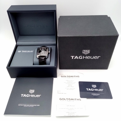 660 - A Tag Heuer Monaco Quartz Gents Watch. Black leather Tag strap. Stainless steel case - 38mm. Black d... 