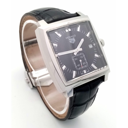 660 - A Tag Heuer Monaco Quartz Gents Watch. Black leather Tag strap. Stainless steel case - 38mm. Black d... 