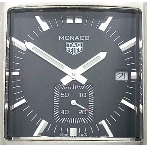 660 - A Tag Heuer Monaco Quartz Gents Watch. Black leather Tag strap. Stainless steel case - 38mm. Black d... 