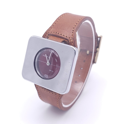 578 - A Vintage Megalo Mechanical Gents Watch. Brown leather strap. Rectangular stainless steel case - 40m... 