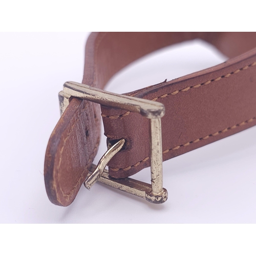 578 - A Vintage Megalo Mechanical Gents Watch. Brown leather strap. Rectangular stainless steel case - 40m... 