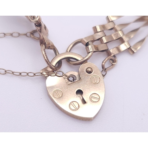 669 - A VERY CUTE MINITURE 9K GOLD GATE BRACELET WITH 
 HEART PADLOCK AND SAFETY CHAIN .  3.8gms    17cms