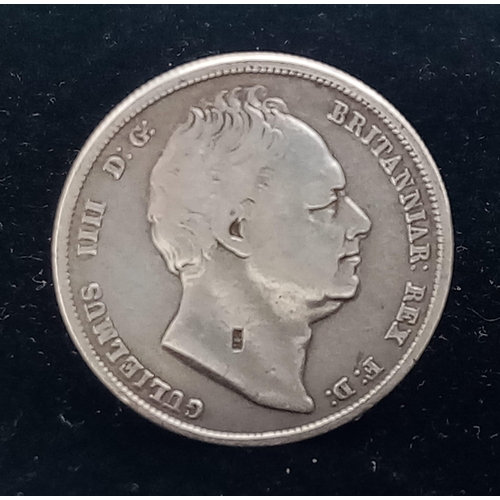 890 - An 1836 William IV Silver Half Crown. VF grade but please see photos for conditions.