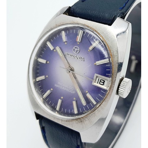 780 - A Vintage Rodania Mechanical Gents Watch. Blue leather strap. Stainless steel case - 32mm. Purple di... 